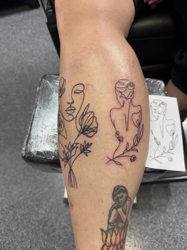 Fine-line figure and flower calf tattoos (owner-posted)